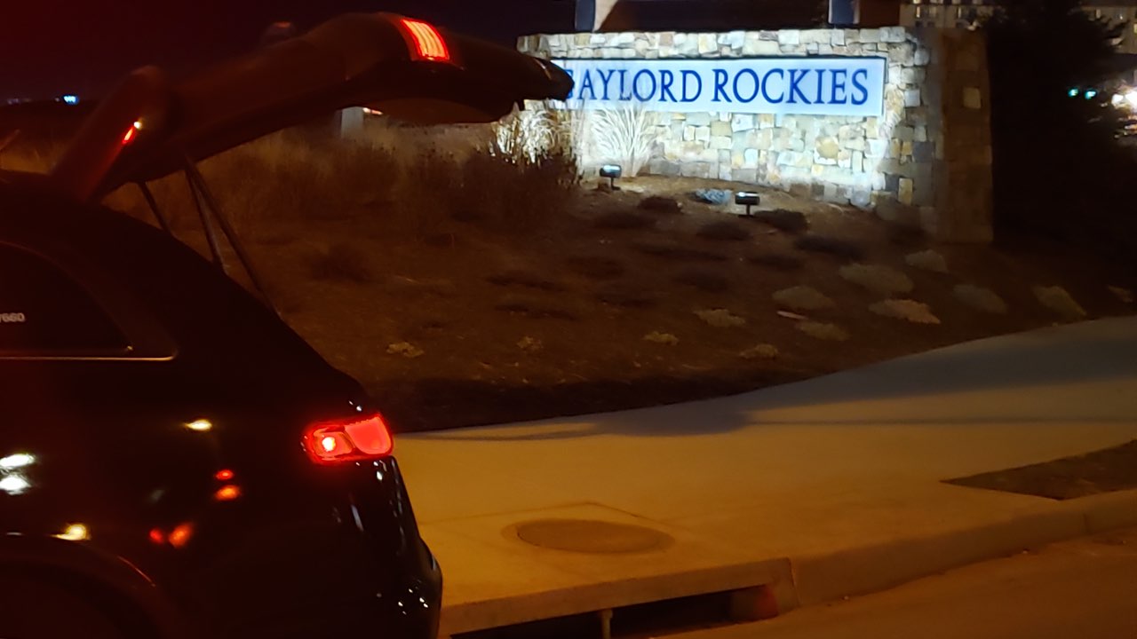 007 Limo Denver black car leaving the Gaylord Rockies Resort after a ride from Denver international Airport