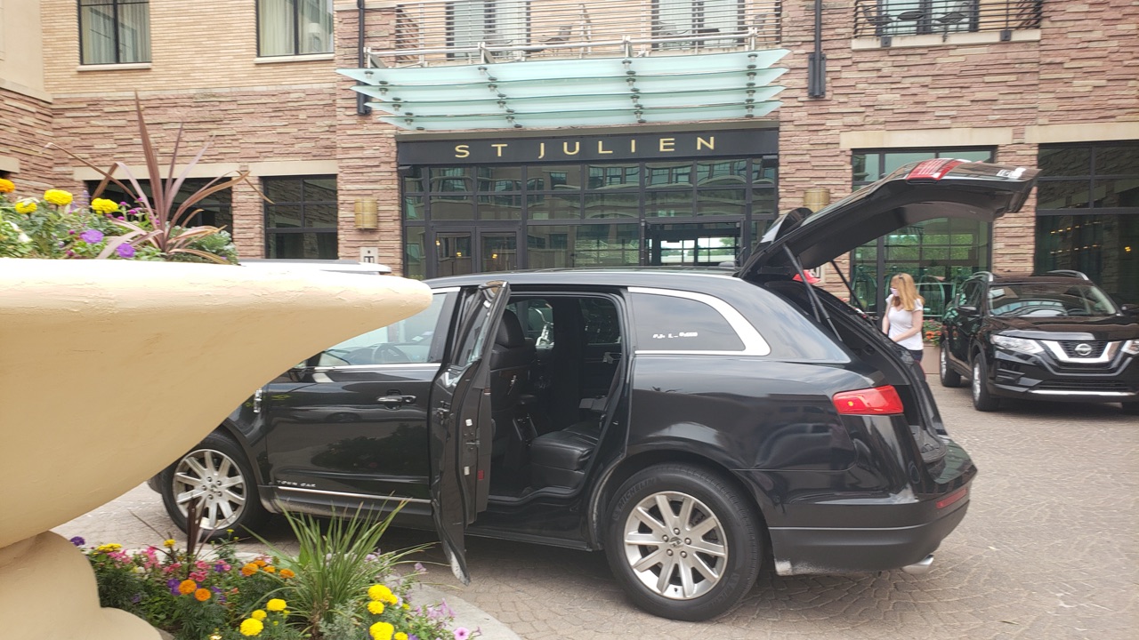 town car waiting for a ride outside St Julien Hotel Boulder Colorado