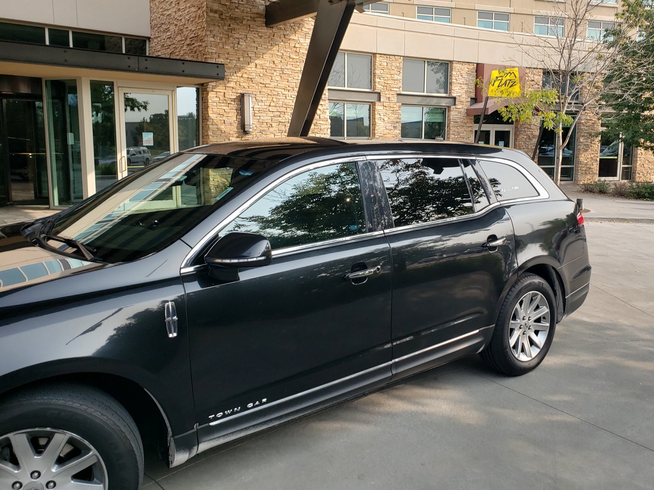 Private Lincoln car sedan waiting for a ride outside The Renaissance Hotel in Broomfield Colorado