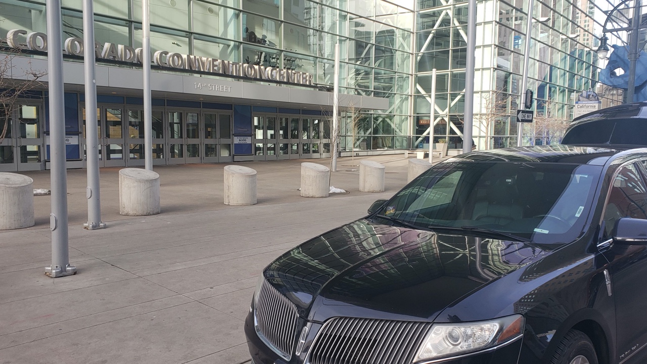 black car waiting for customer at Convention Center Denver