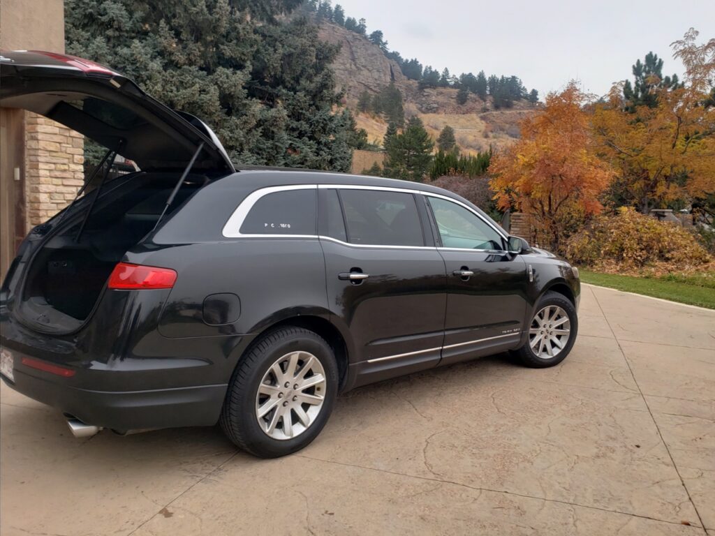 town car waiting for a customer, ride to DIA